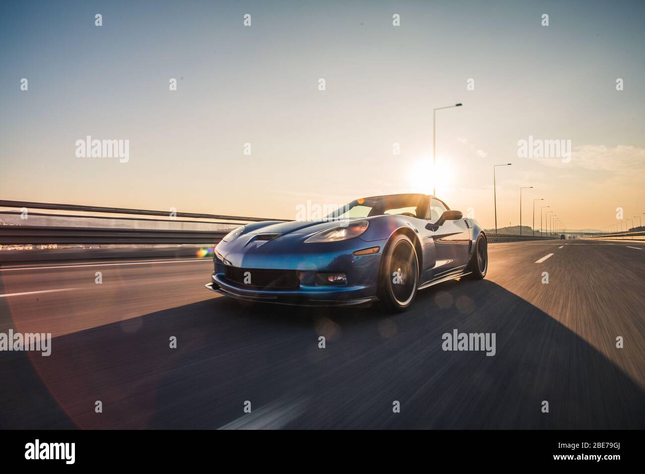 Blue brand sport model car, under the sunny sky Stock Photo Alamy