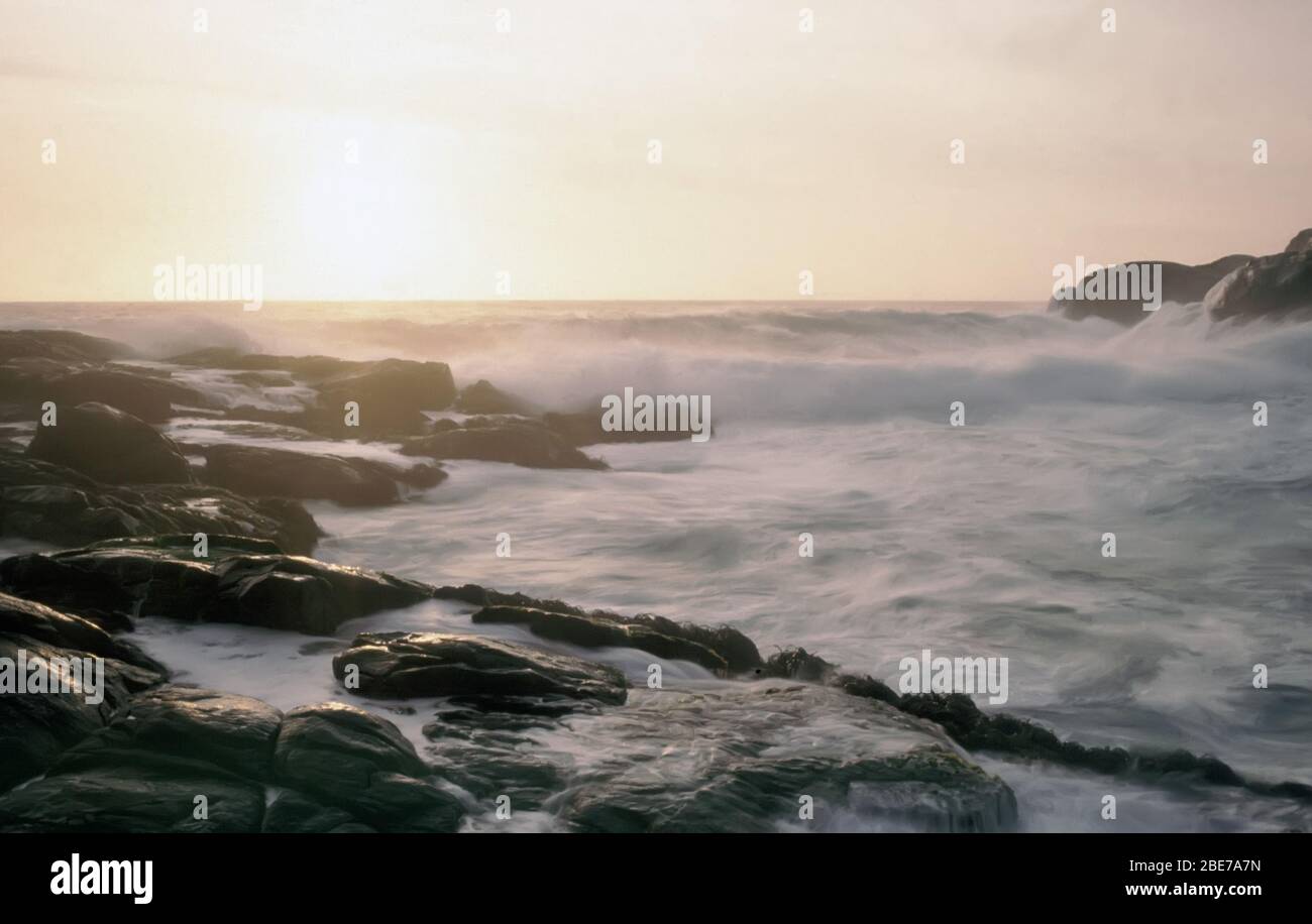 Waves break over rocks at Zapalla, Chile Stock Photo