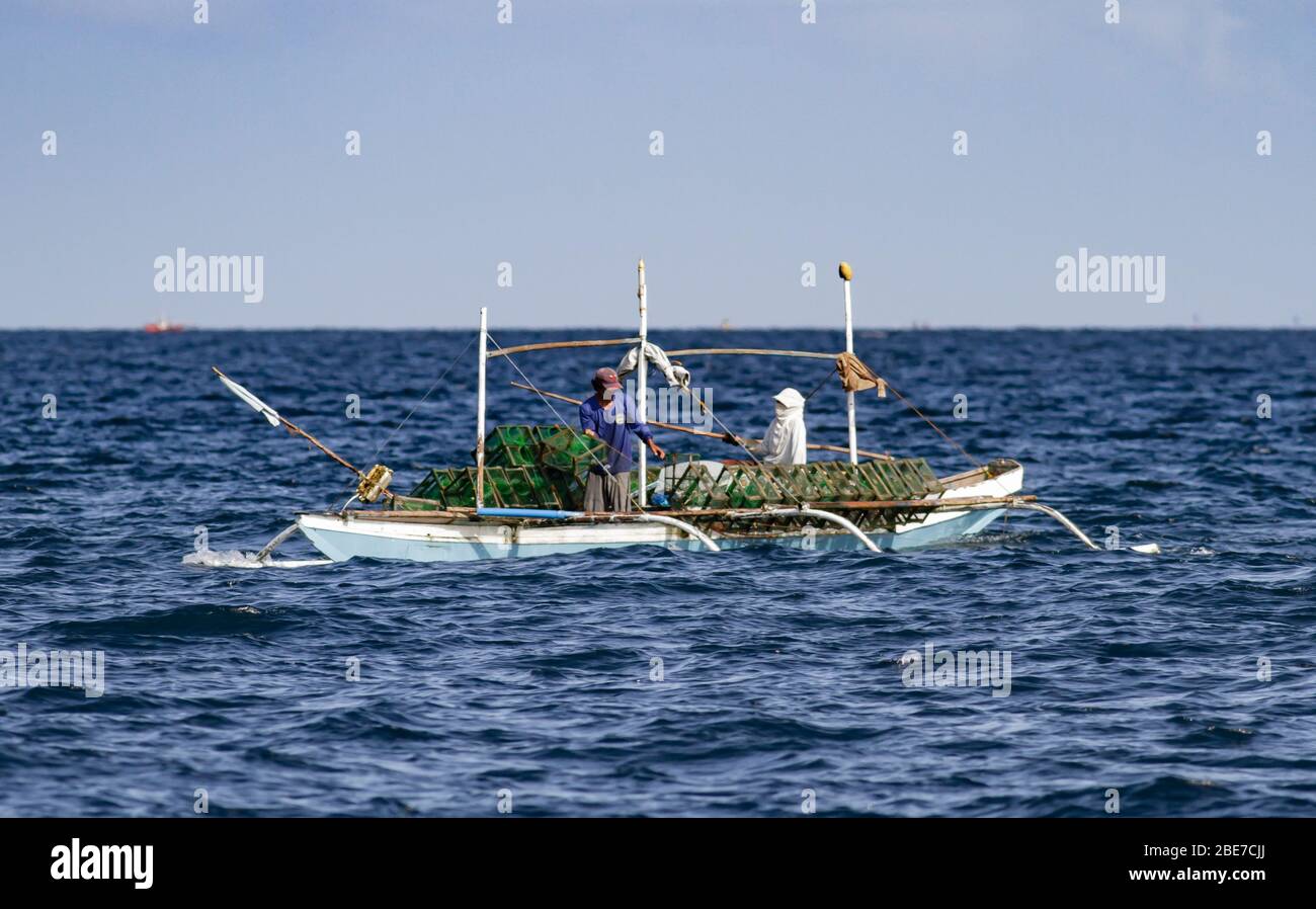 Outrigger fishing boat in the Philippines — Stock Editorial Photo © epixx  #271516258