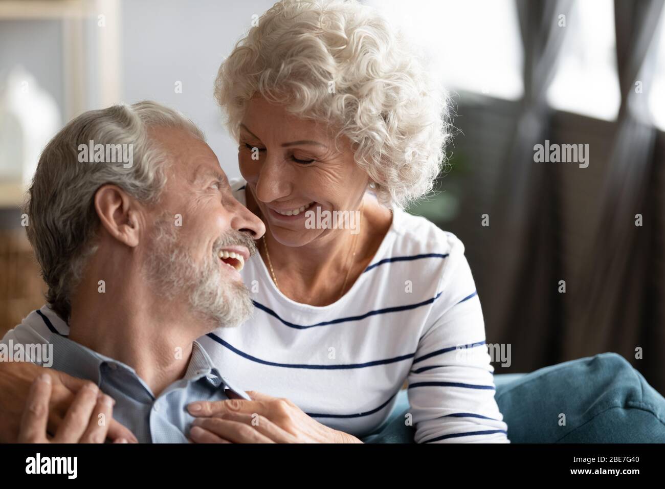 Happy older woman and man having fun together close up Stock Photo