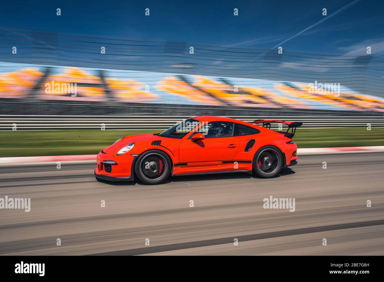 Red sport model car on the racing trace Stock Photo Alamy
