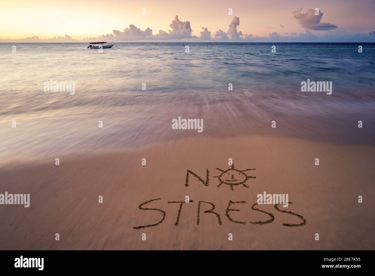 Handwritten No Stress on sandy beach at sunset,relax and summer concept,Dominican republic beach. Stock Photo