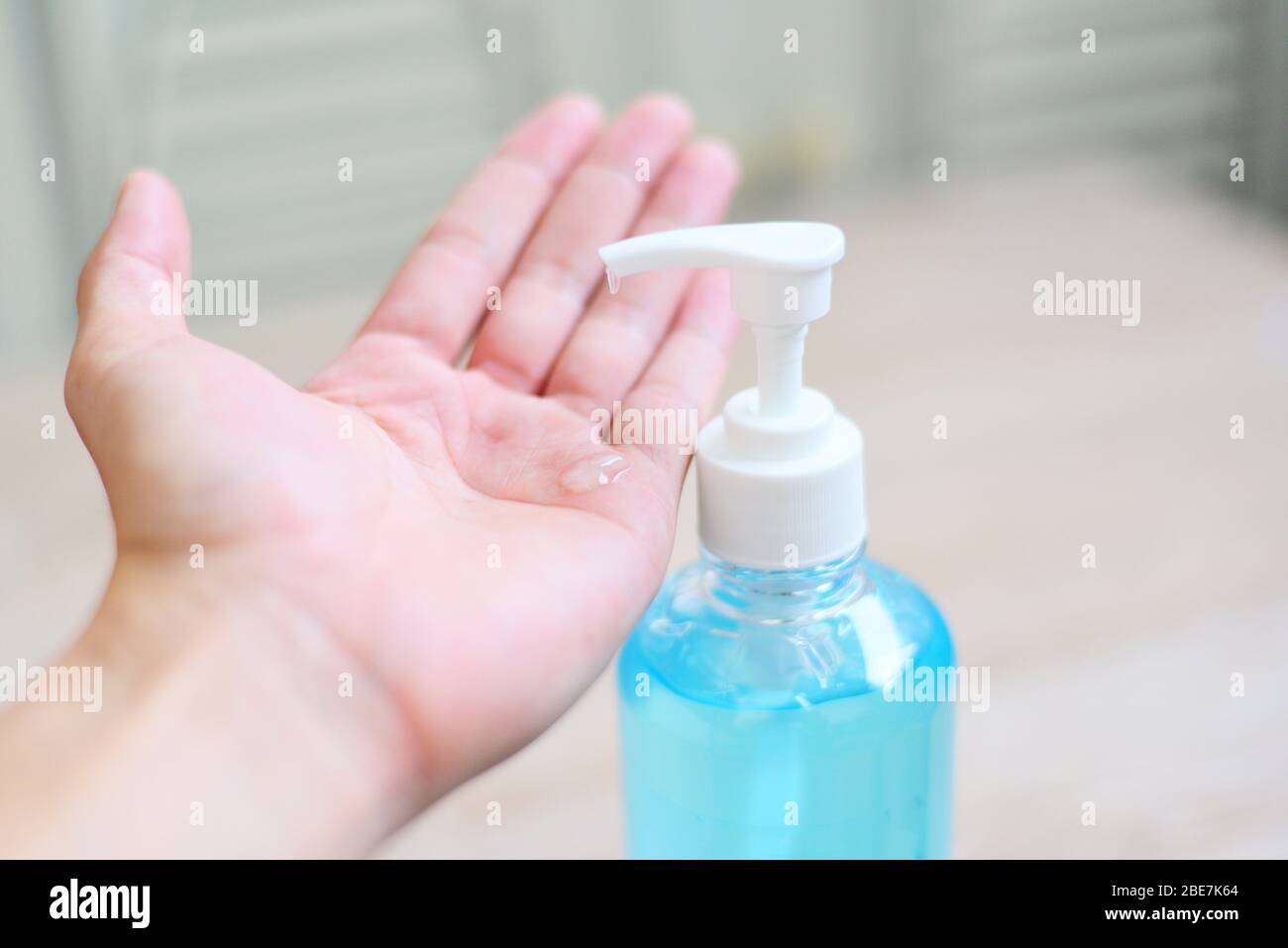 Women washing hands with alcohol gel or antibacterial soap sanitizer ...