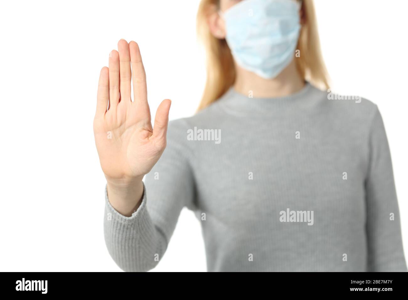Short Stop Mask Front view close up of woman with protective mask doing stop sign ...