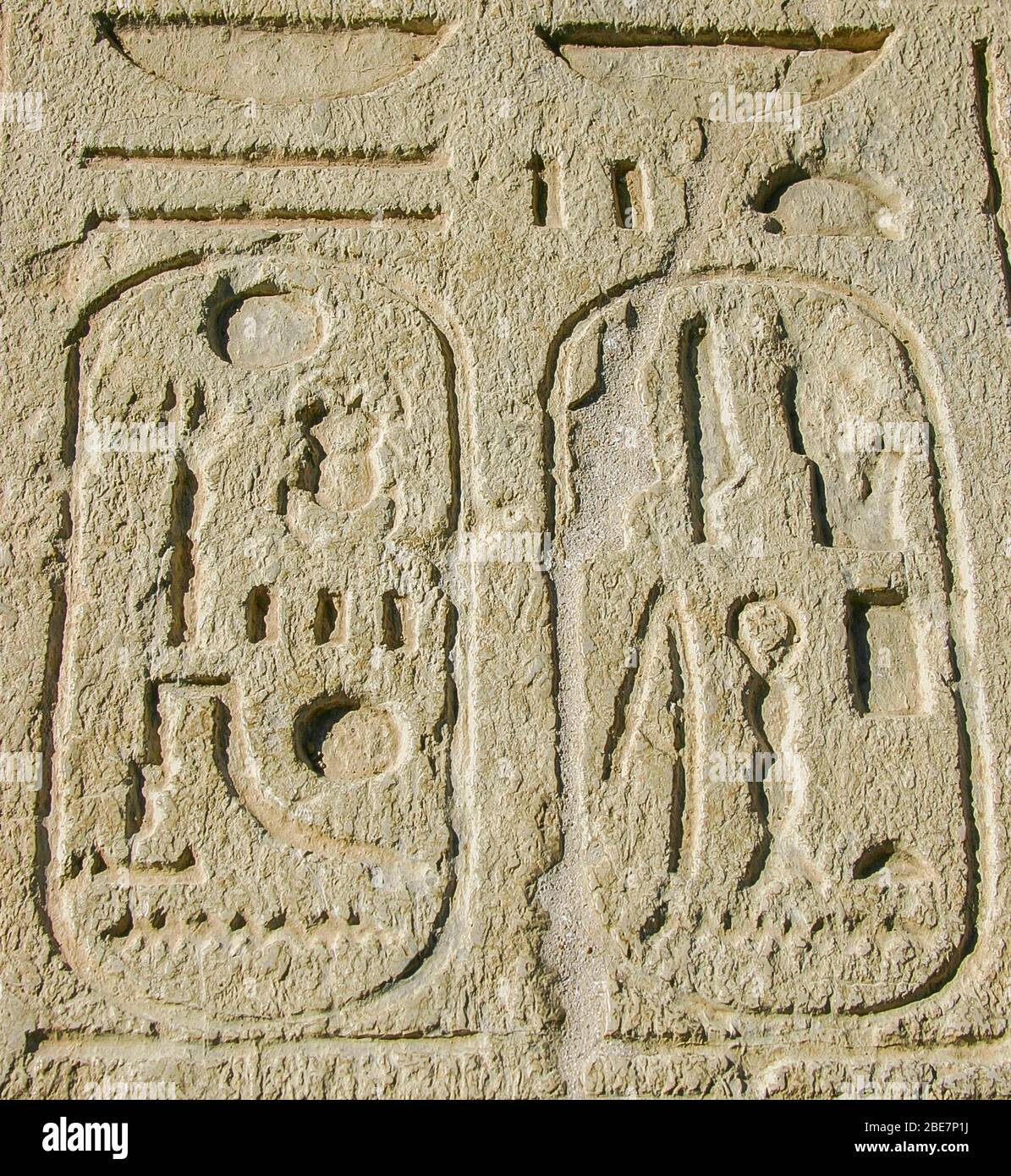 Egypt, Cairo, Heliopolis, open air museum, obelisk parc.  Detail of  a statue of the king Sethy II  : Cartouches of the king on the offering table. Stock Photo
