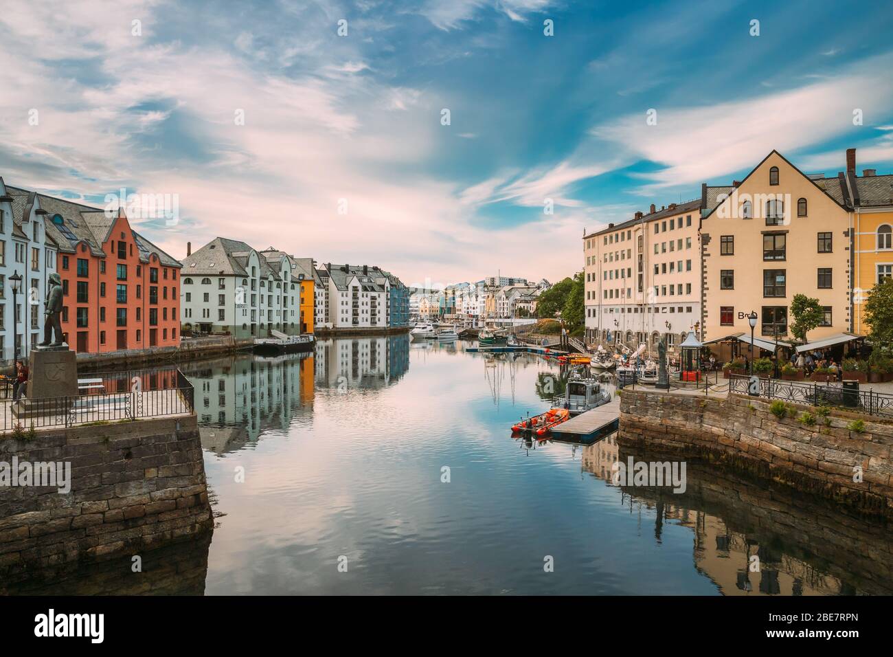 Alesund, Norway - June 19, 2019: Old Wooden Houses In Cloudy Summer Day. Art Nouveau Architecture Is Historic Heritage And Landmark. Stock Photo