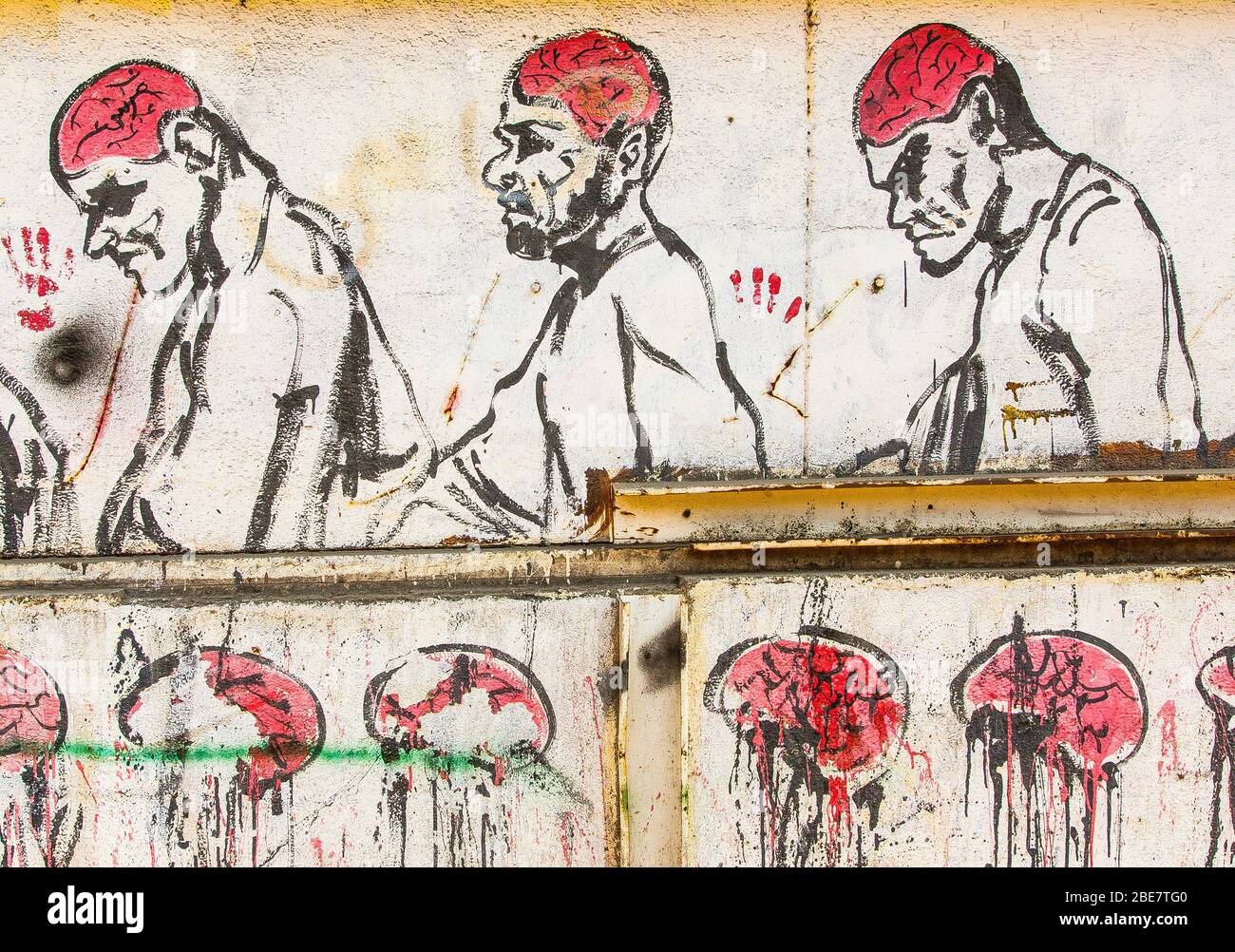 Egypt, Cairo, graffiti of the Egyptian revolution on Mohamed Mahmoud Street. Bloody image, stating that Muslim Brotherhood movement damages the brain. Stock Photo