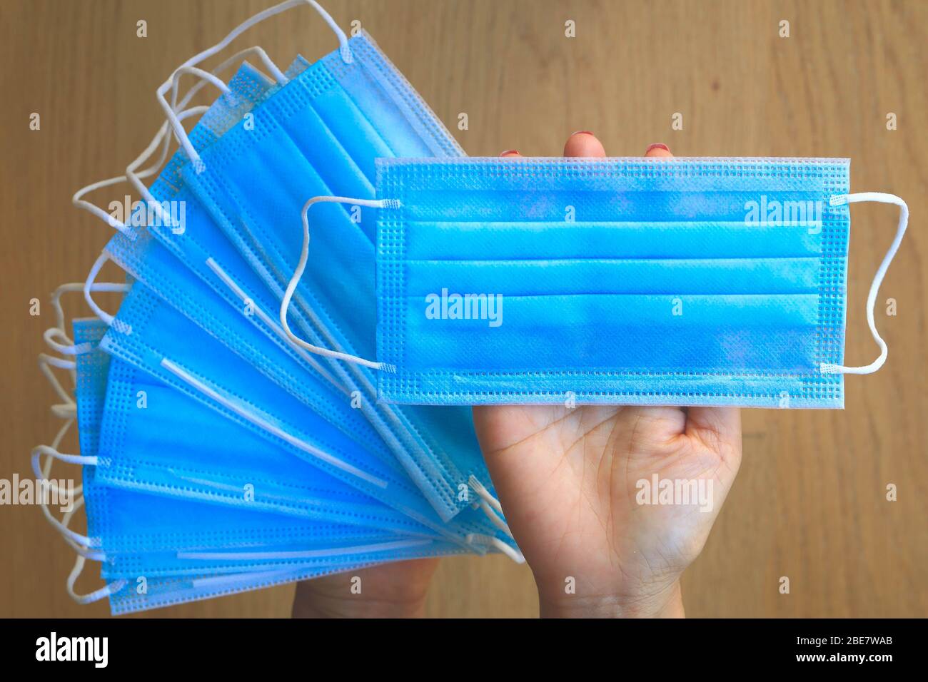 Medical disposable protective face masks on hand Stock Photo