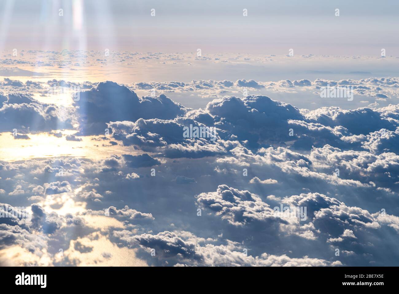 Skyline View above the Clouds from airplane Stock Photo - Alamy