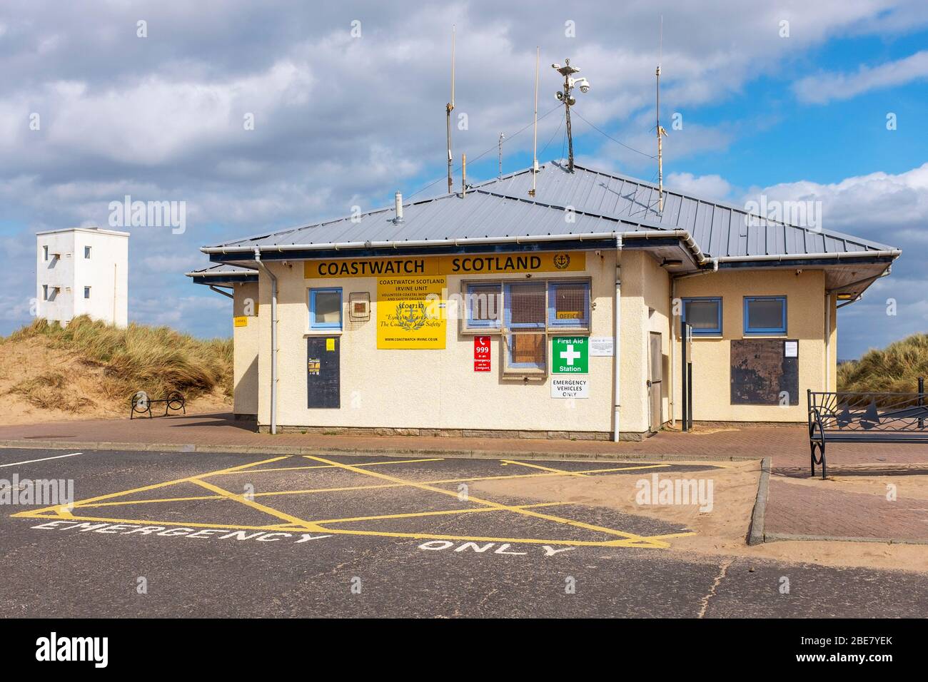 Office of Coastwatch Scotland at Irvine where the volunteer coastguards monitor the sea and beach from the office and old harbour master's tower (left Stock Photo