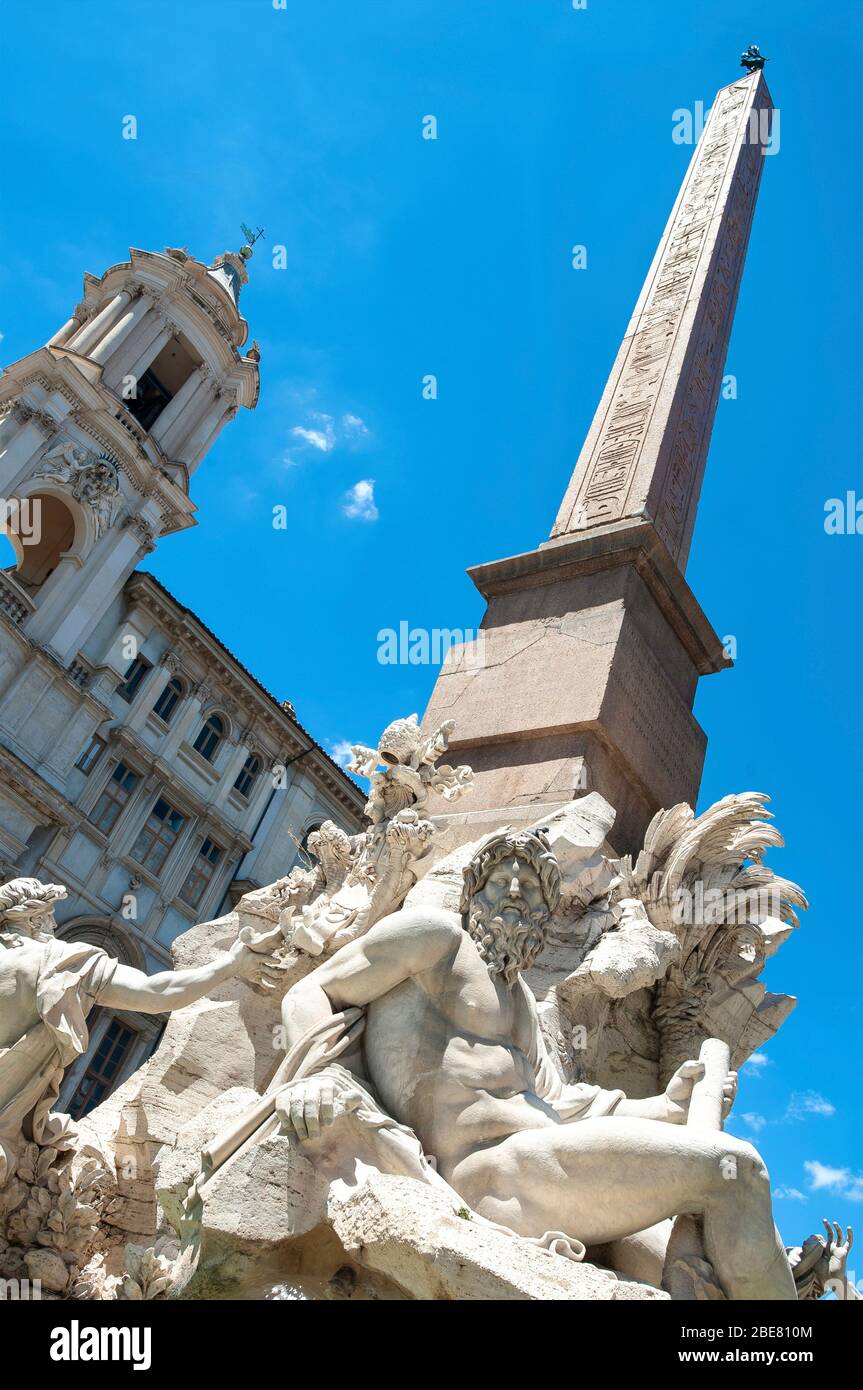 The Fountain of the Four Rivers (Fontana dei Quattro Fiumi) topped by an egyptian obelisk in the Piazza Navona, Rome, Italy Stock Photo