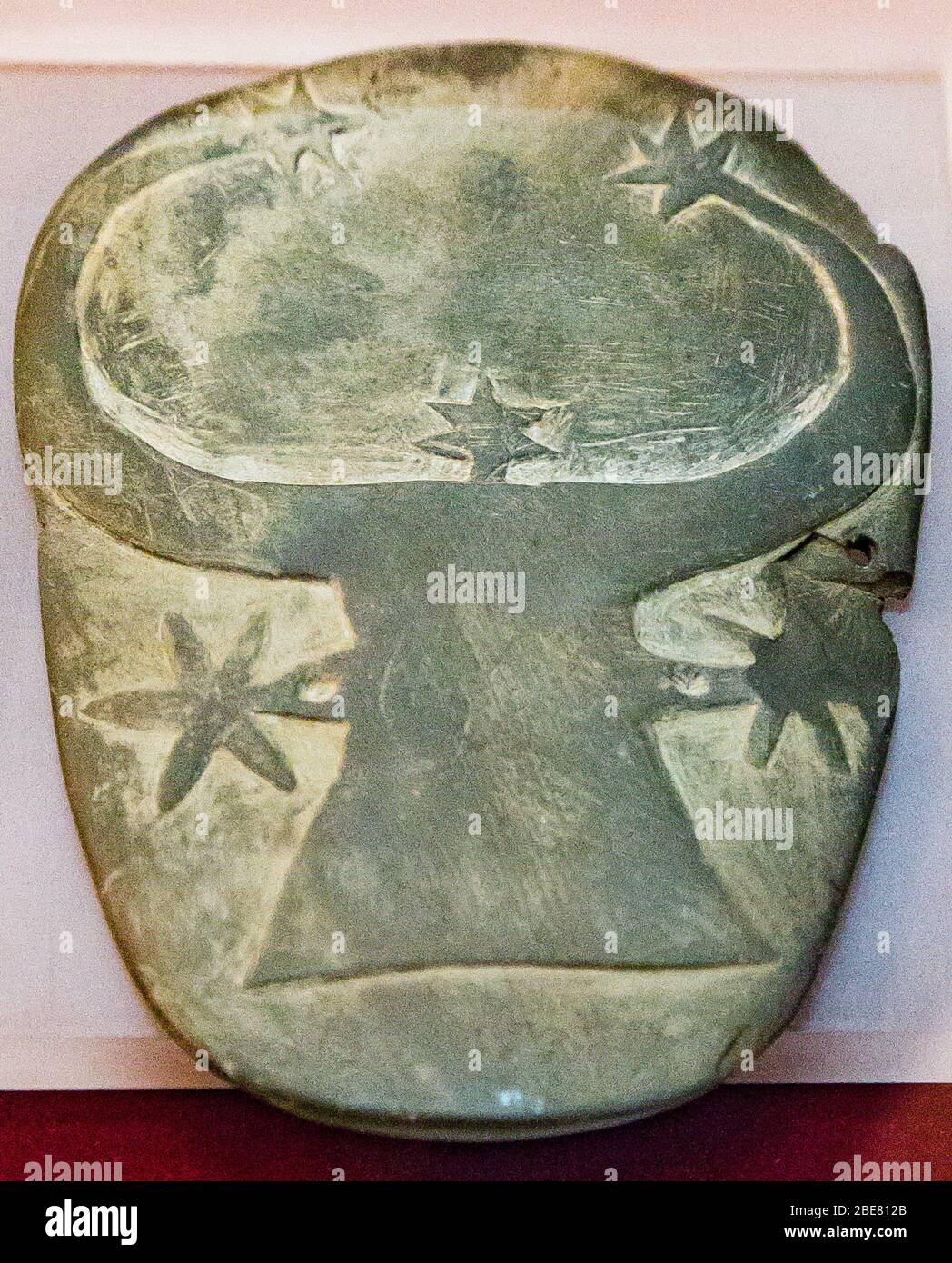 Egypt, Cairo, Egyptian Museum, schist palette showing a cow head and stars. From Girza, Predynastic period. Stock Photo