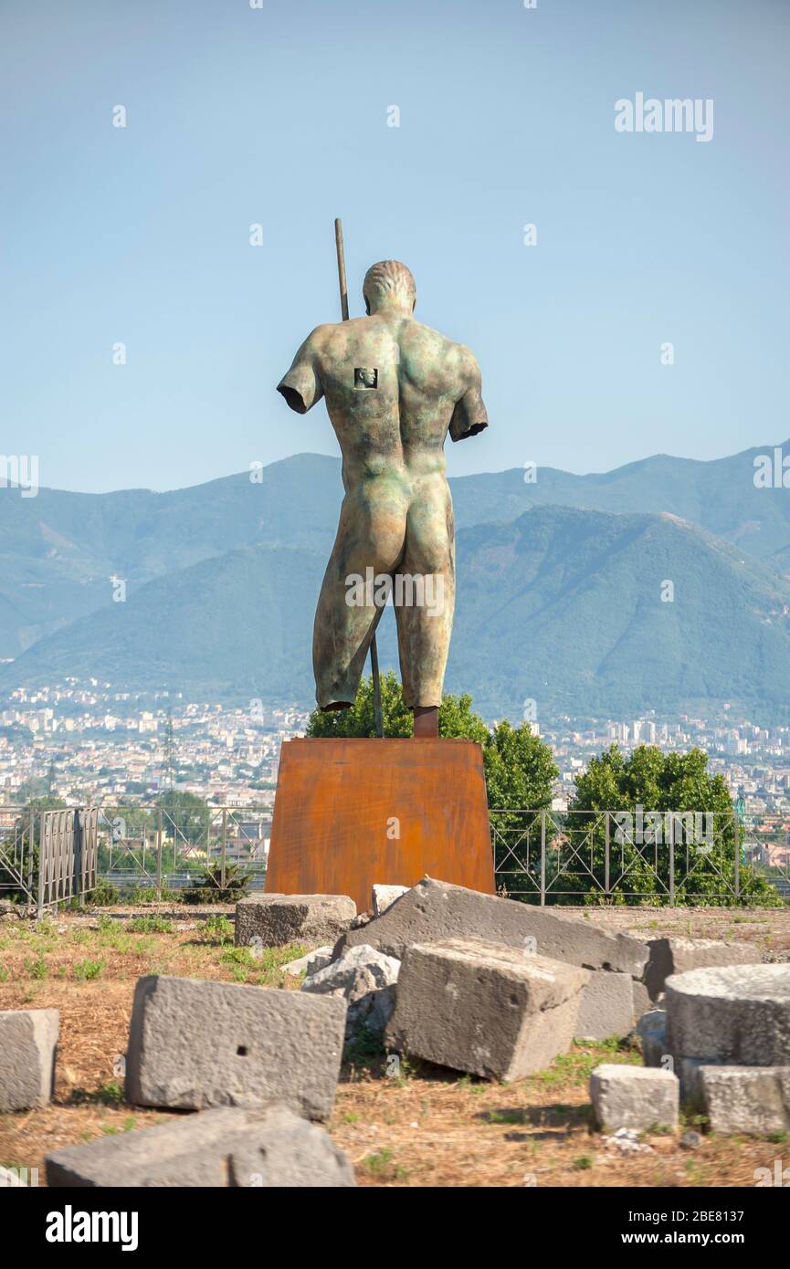Bronze sculpture by Igor Mitoraj looks out over the countryside during a temporary exhibition of the artist's work in the ancient city of Pompeii, Ita Stock Photo