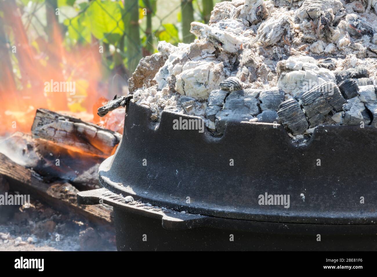 Cooking of traditional Croatian meal Peka in metal pots called sac ...
