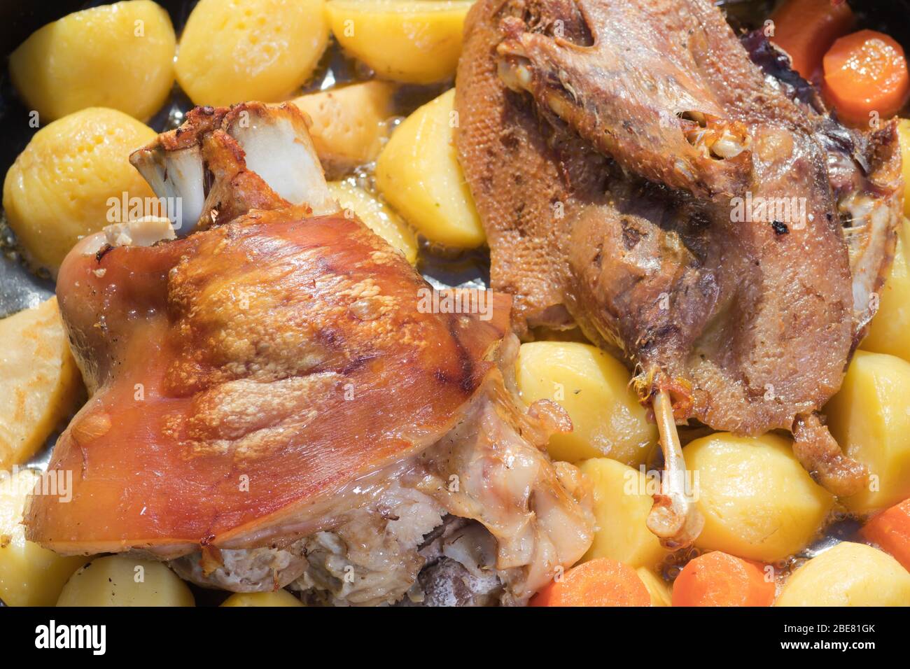 Cooking of traditional Croatian meal Peka in metal pots called sac