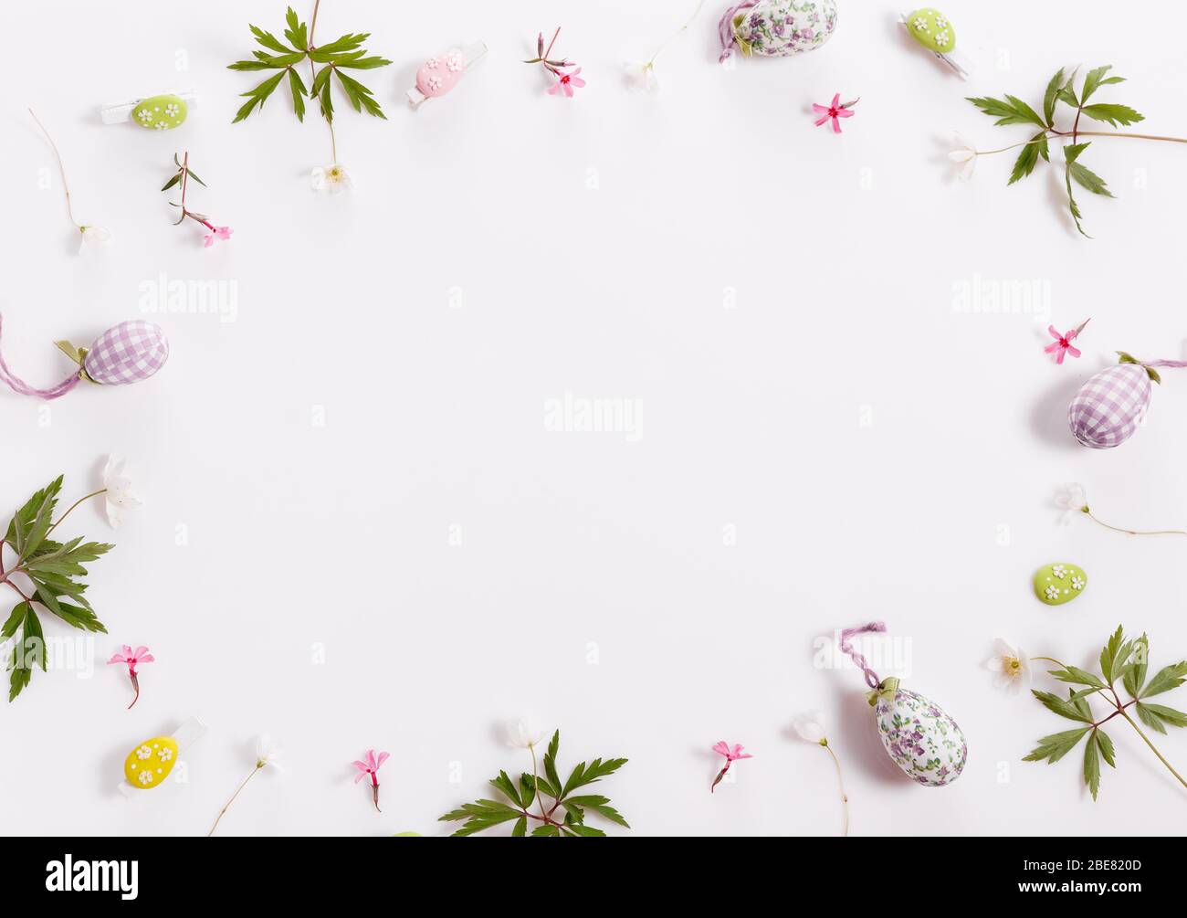Easter background with Easter eggs and spring flowers. Top view with ...