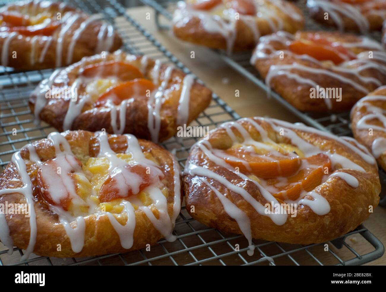 Danish pastries filled with peaches and creme patissiere, made by Scotland-based artisan baker Louise Paterson Stock Photo