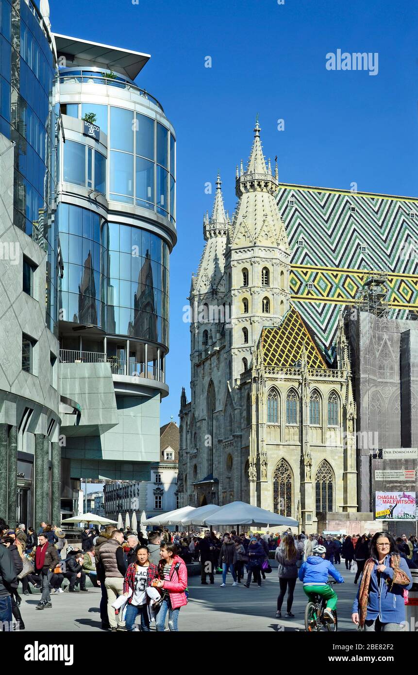 Vienna, Austria - March 27th 2016: Unidentified people on Stephansplatz with Haas Hausl and Stephansdom - church in center of the city, a preferred to Stock Photo