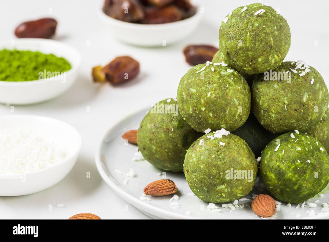 Homemade raw energy balls made of green matcha tea, dates and nuts. Healthy vegan dessert food
