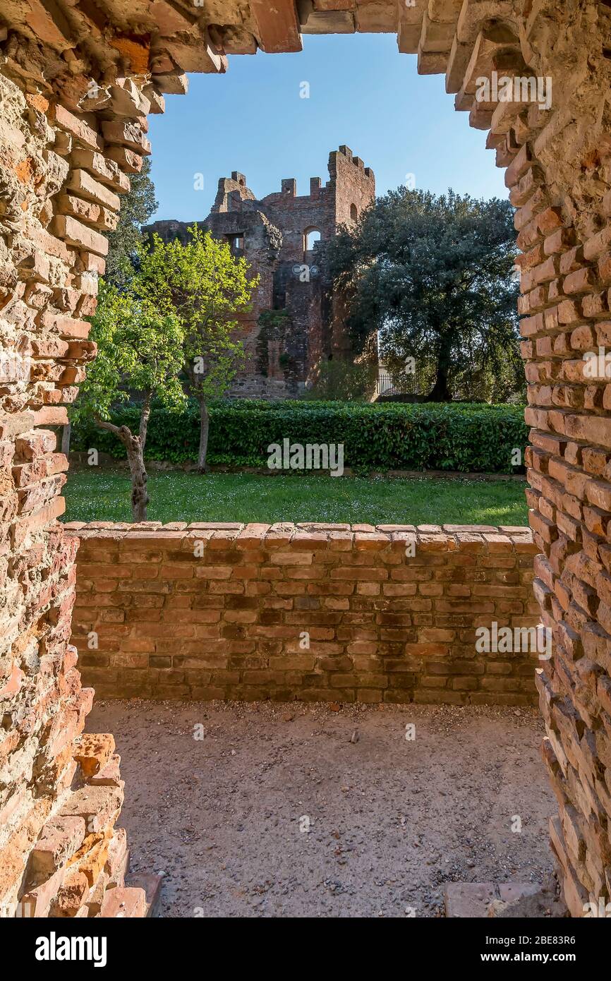 The Torre Grossa tower of Parco Corsini seen through an opening of the Torre di Mezzo tower, historic center of Fucecchio, Florence, Italy, Europe Stock Photo
