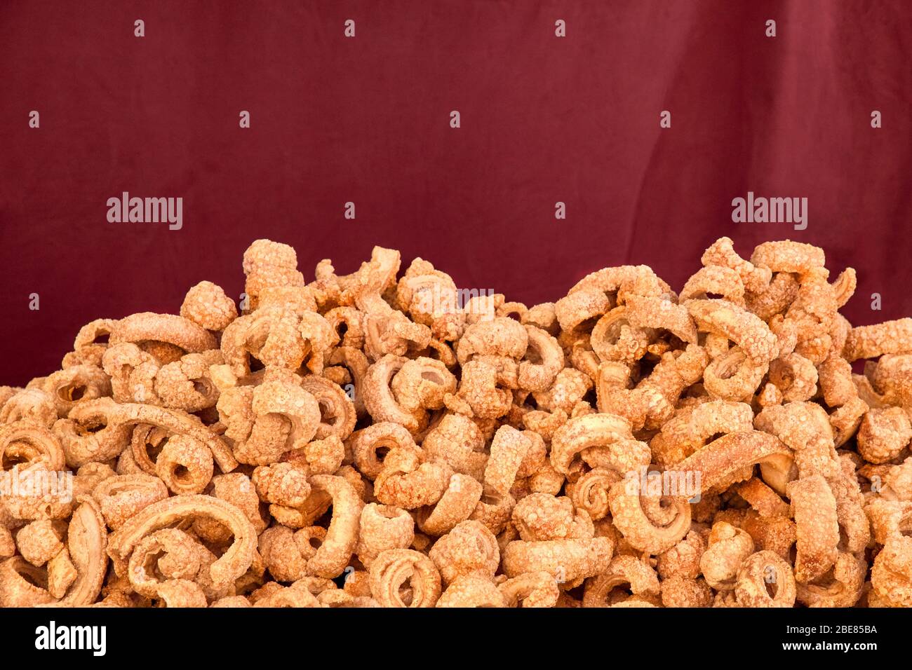 freshly made pork rinds from a street stall. Concept bad food Stock