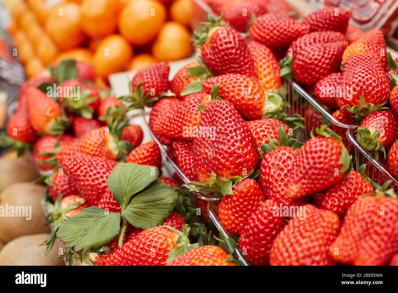 Background image of fresh ripe strawberries ready for sale at stand in farmers market, copy space Stock Photo