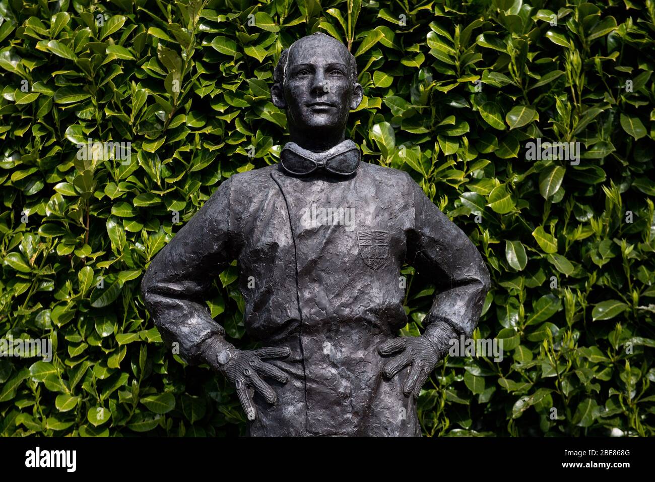 A statue of Sir Stirling Moss stands without any floral tributes at Mallory Park circuit, Leicestershire, following his death aged 90, with fans unable to visit due to the Coronavirus lockdown. Stock Photo