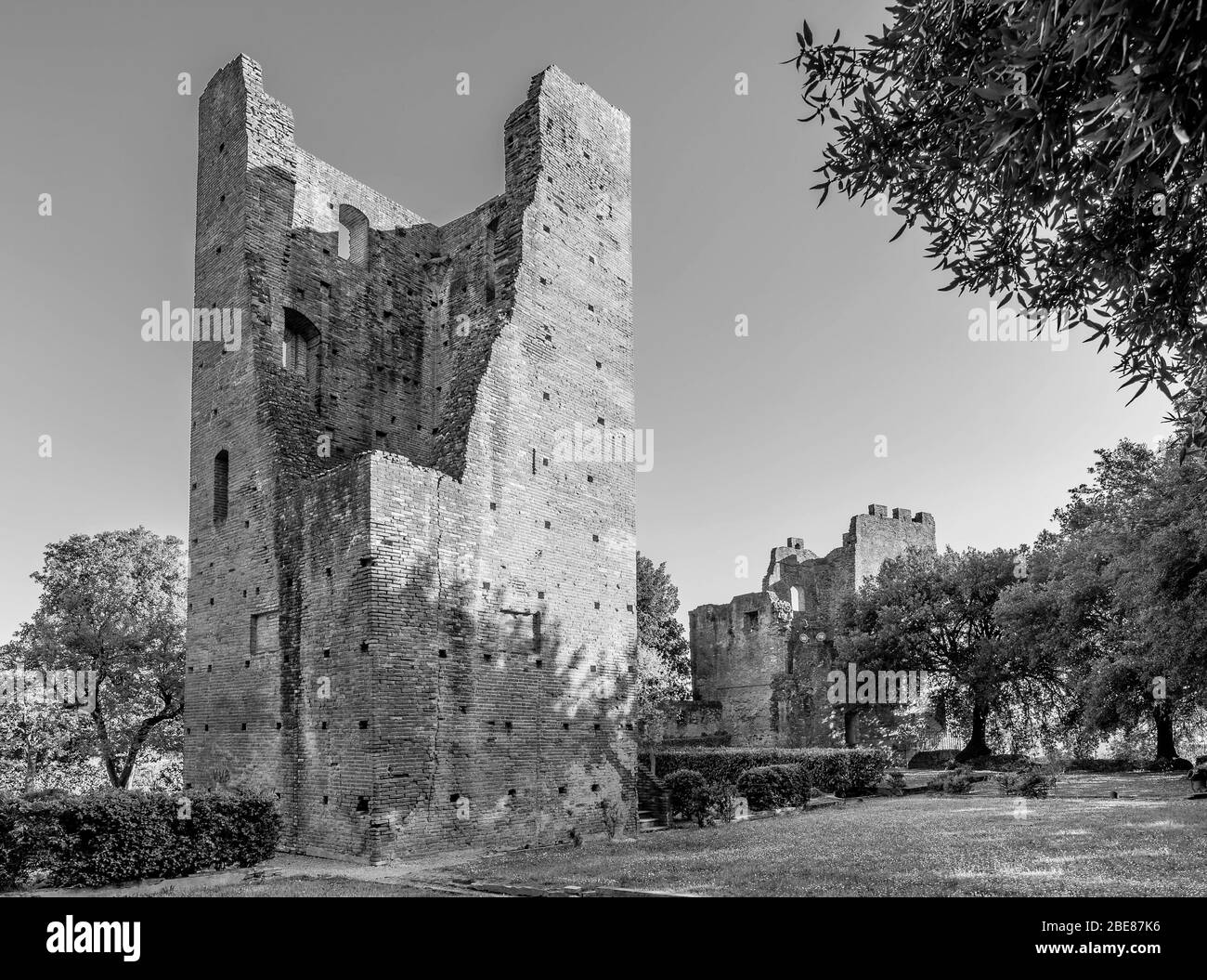 The ancient Torre di Mezzo tower in the Corsini park in Fucecchio, Florence, Italy, on a beautiful sunny day, in black and white Stock Photo
