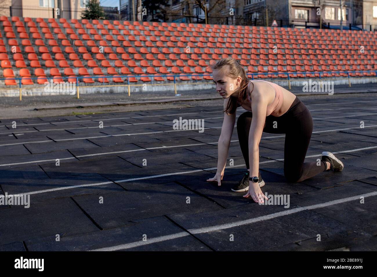 Women getting ready to start running in a stadium Stock Photo - Alamy