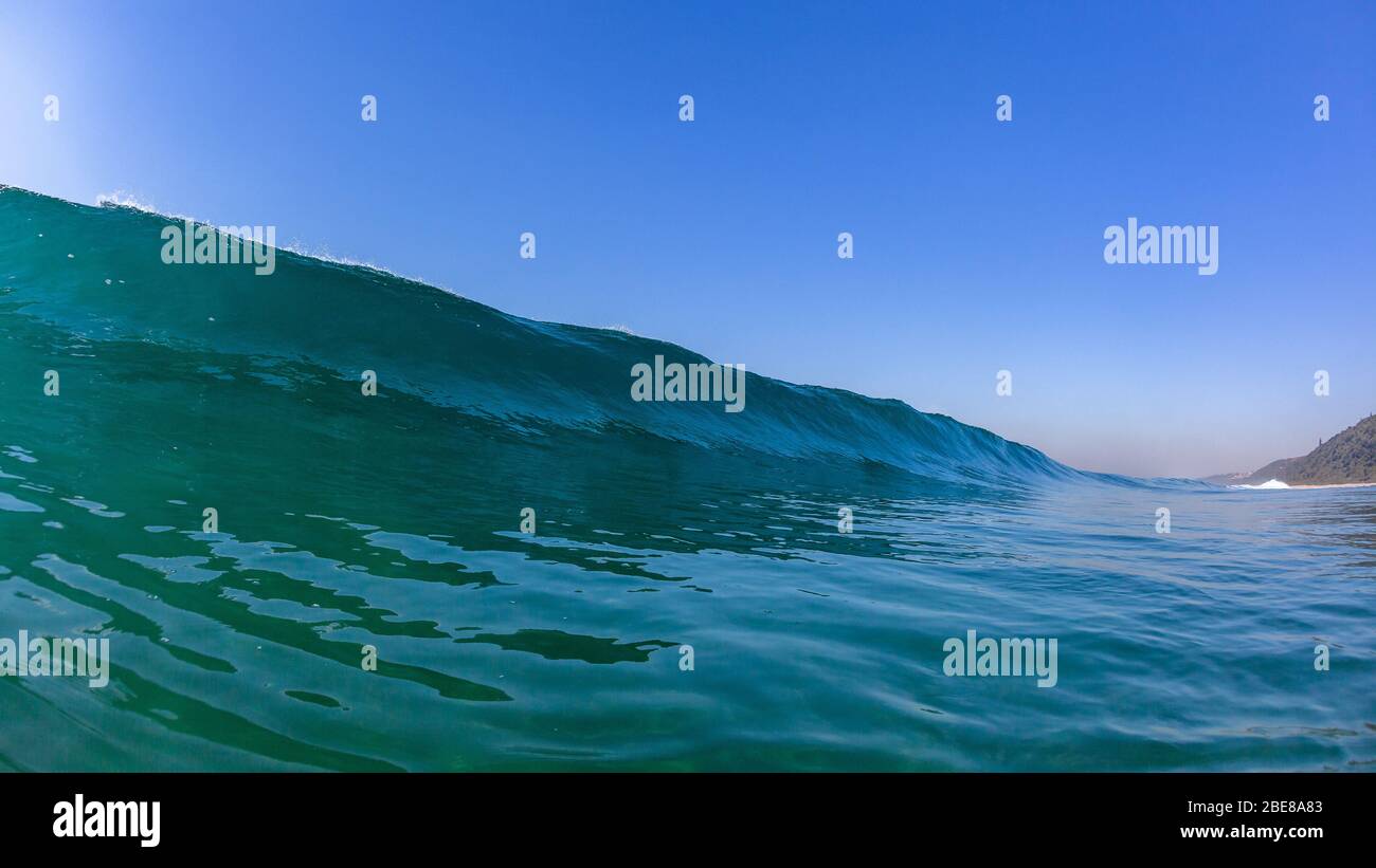 Ocean sea wave long wall of water swimming photo panoramic blue