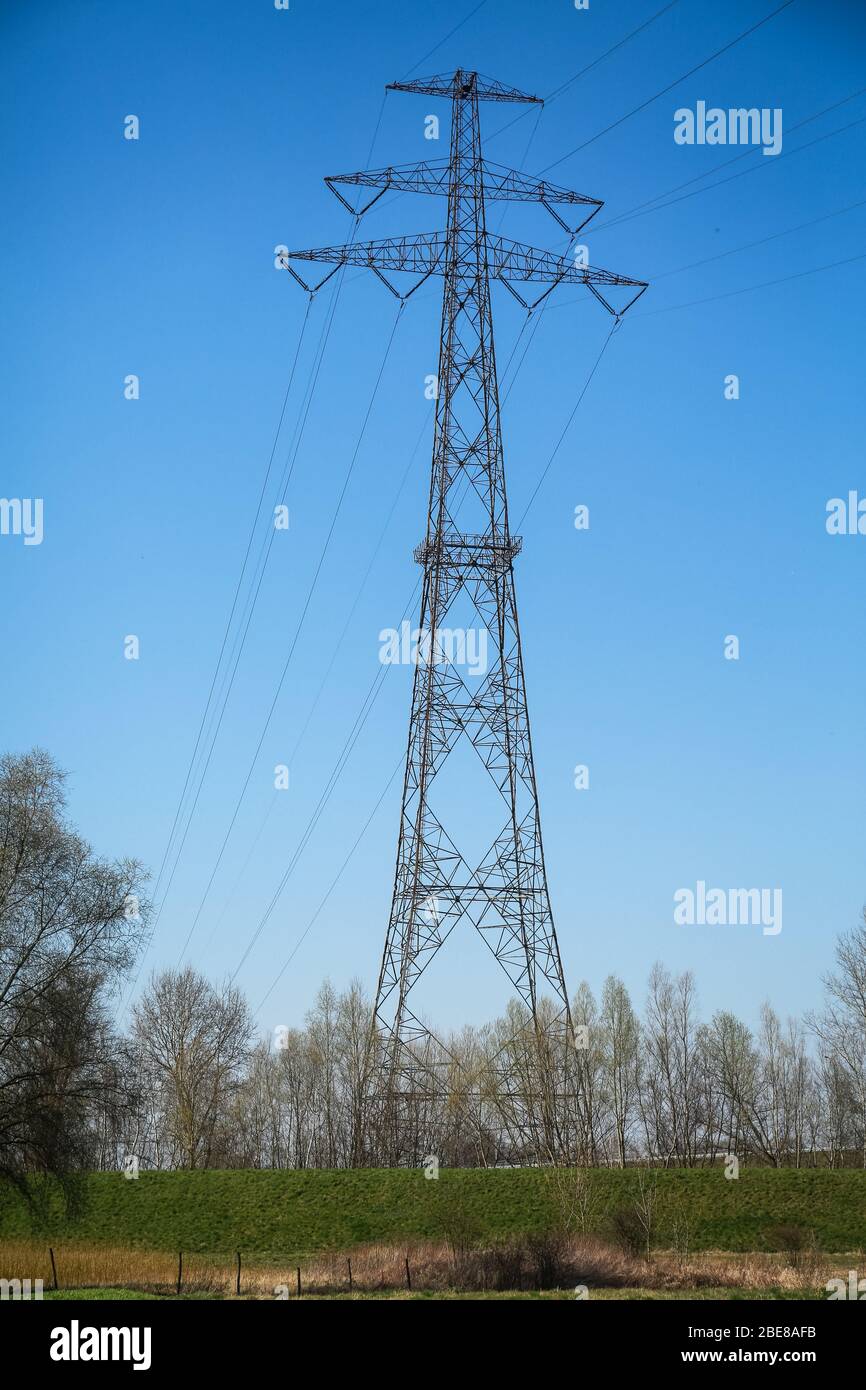 07 Apr 2020. High voltage pylon with power lines for transporting electricity in the Poland landscape. Credit: Waldemar Sikora Stock Photo