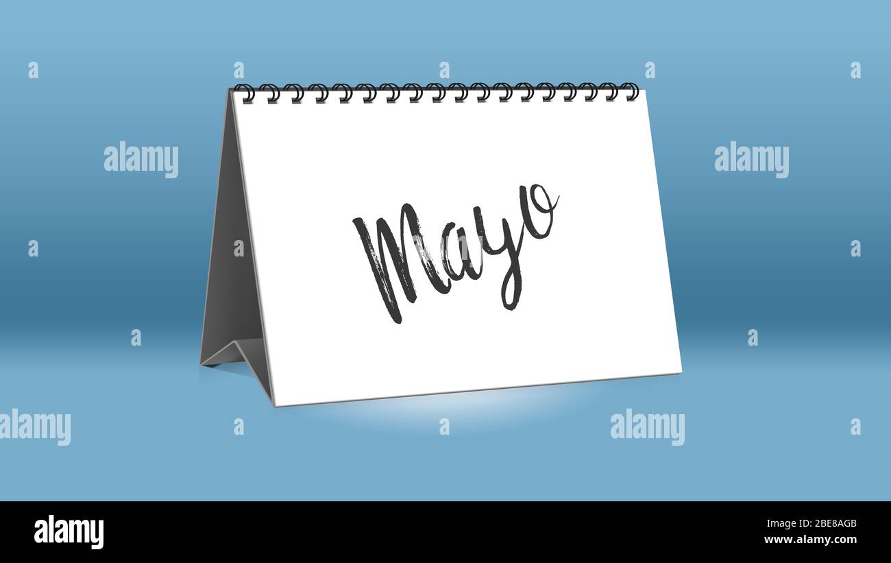 A calendar for the desk shows the Spain month of Mayo (May in English  language Stock Photo - Alamy