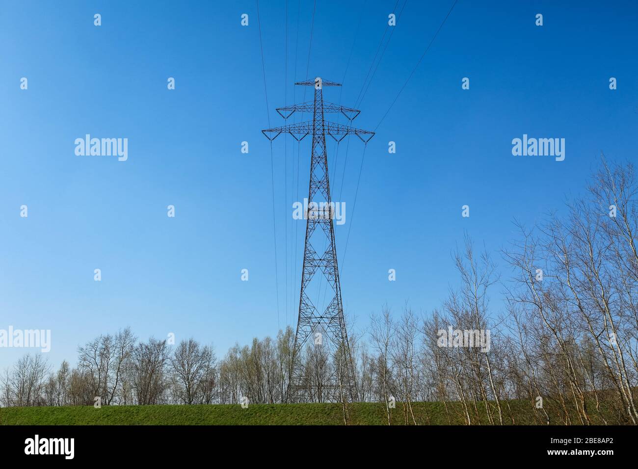 07 Apr 2020. High voltage pylon with power lines for transporting electricity in the Poland landscape. Credit: Waldemar Sikora Stock Photo