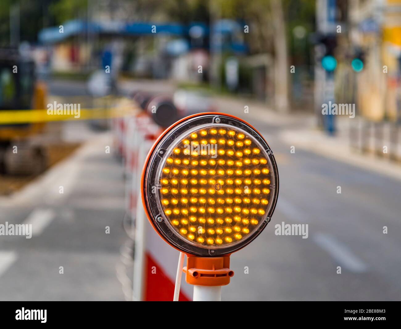 Road multiple Yellow LED lamps circular signal slow traffic warning sign work in progrss Stock Photo