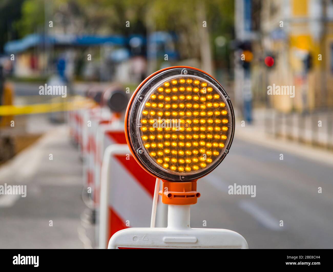Road multiple Yellow LED lamps circular signal slow traffic warning sign work in progrss Stock Photo