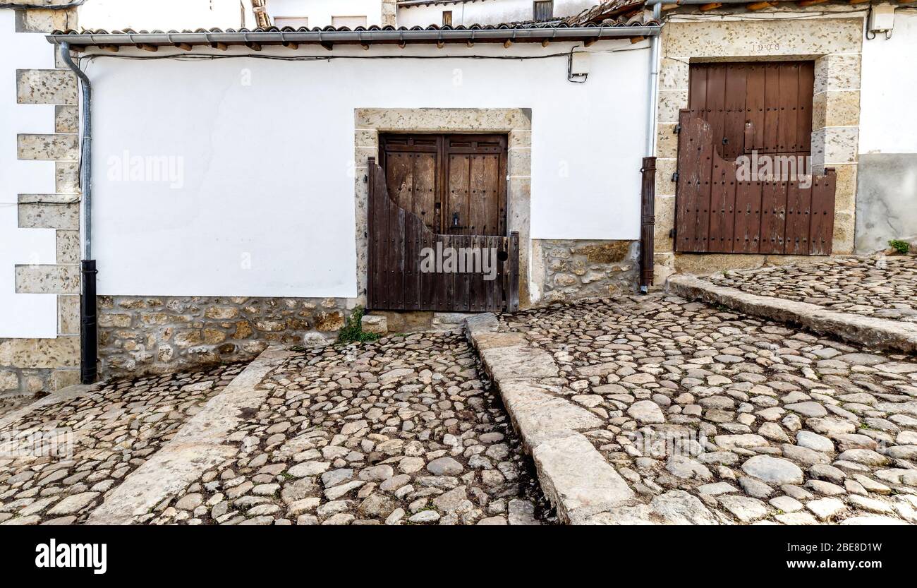 Popular architecture in Candelario. Spain.  View of entrance of the houses with its “Batipuerta”, half door made of wood Stock Photo