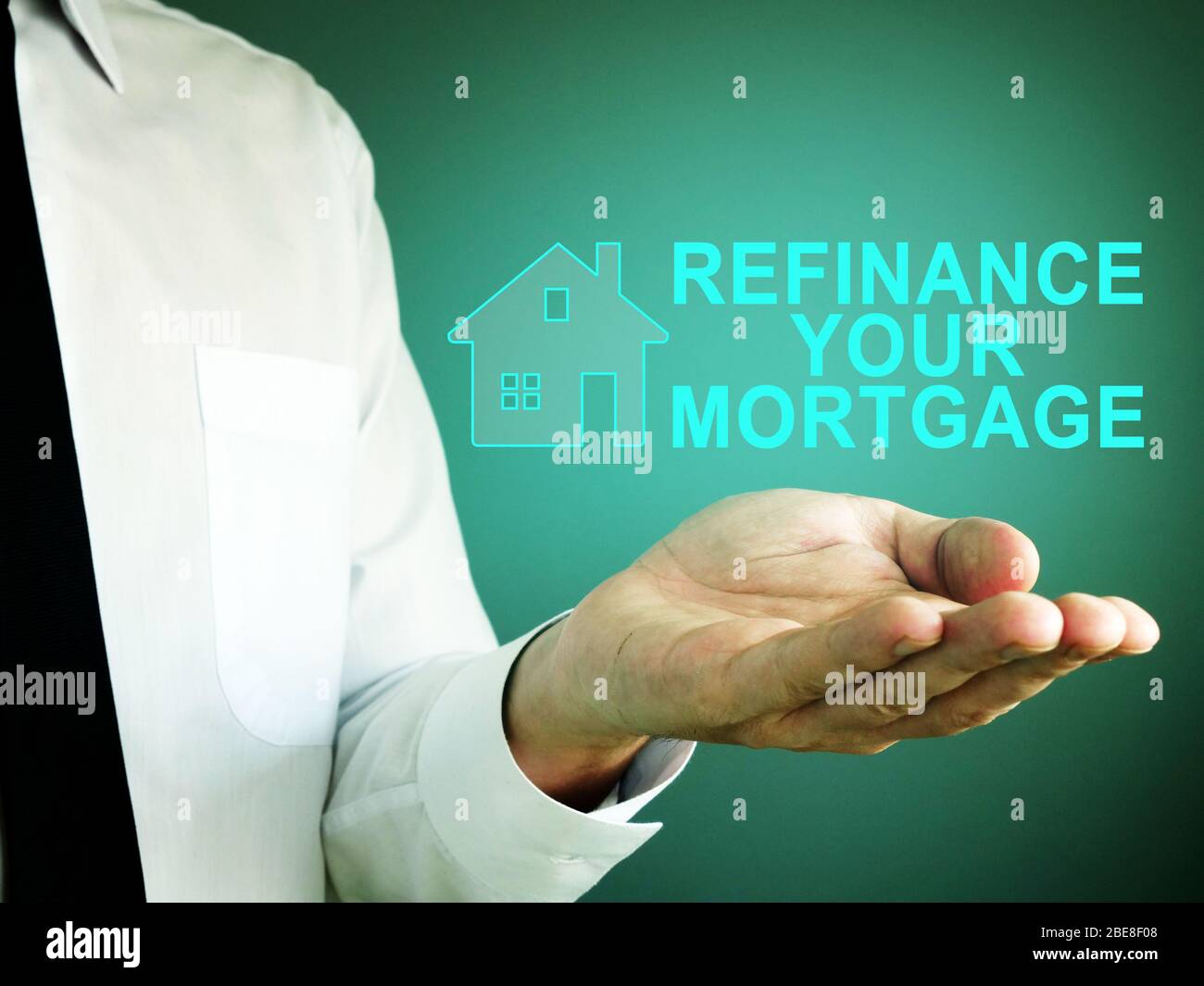 Hand with iscription refinance your mortgage. Stock Photo