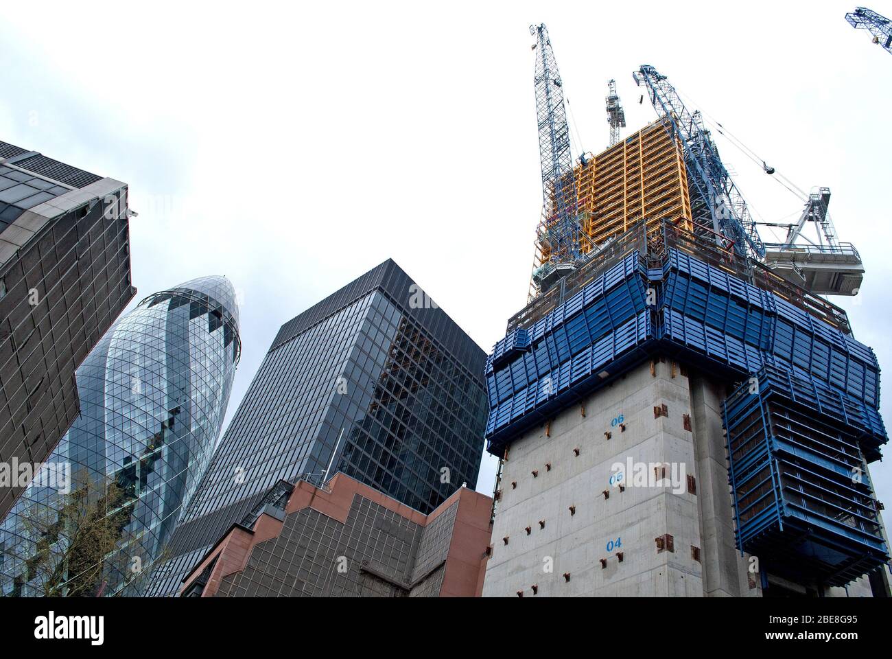 Towers Under Construction Steel Concrete Cranes Frame Structure Engineering 30 St. Mary Axe Gherkin in Aldgate, City of London Stock Photo