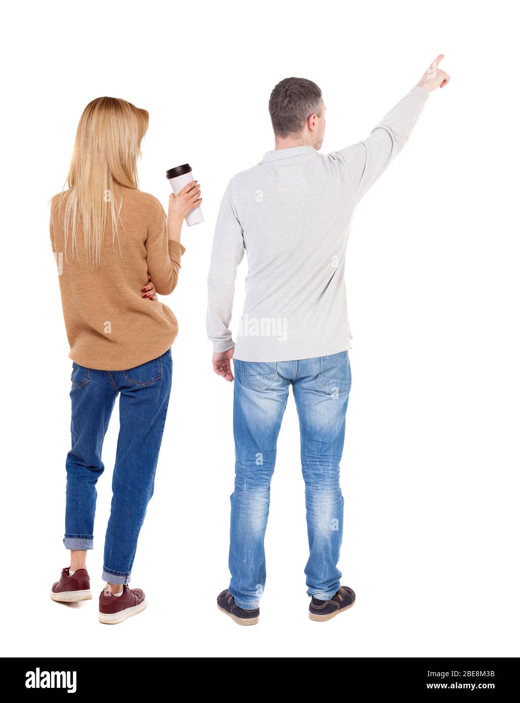Back view of couple in sweater pointing. Rear view people collection ...