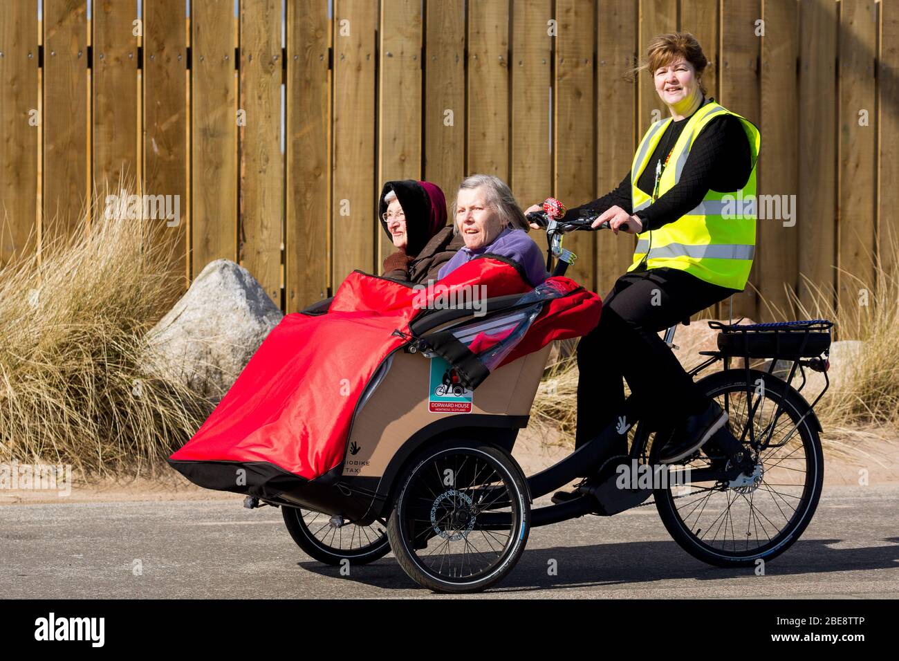 Taking the  elderly out in the open air ,for a refreshing trip to beach front. Montrose Scotland UK Stock Photo