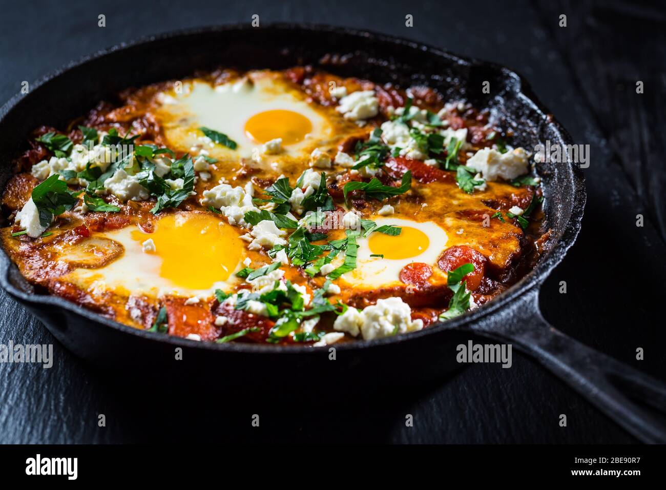 Shakshouka Middle eastern traditional dish with poached eggs in