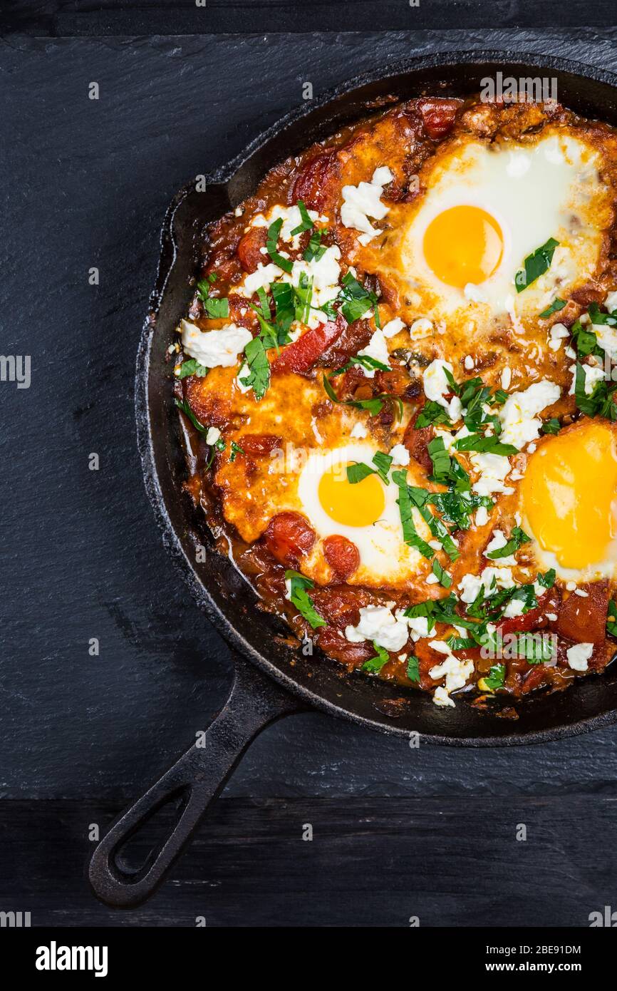 Shakshouka Middle eastern traditional dish with poached eggs in