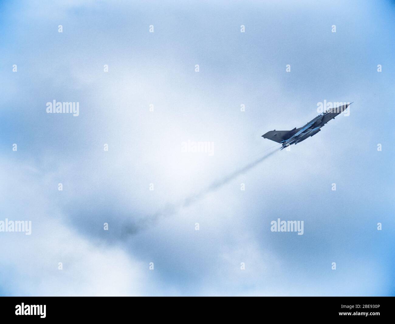 Brescia, Italy - June 10, 2019: Fighter plane speeding through the sky armed with bombs during a military exercise. Stock Photo