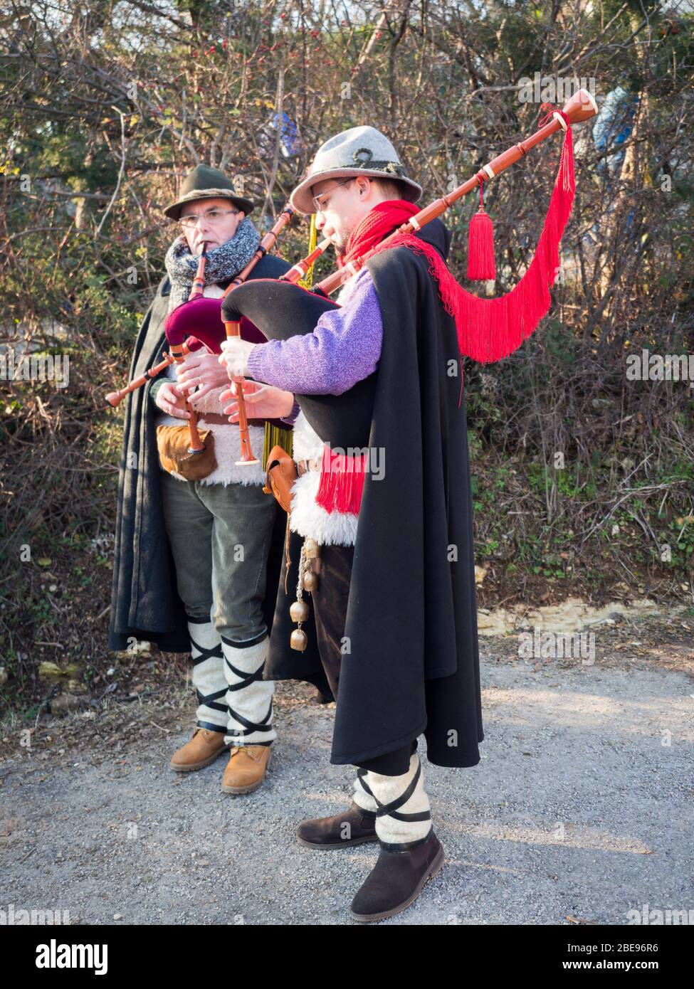 Vicenza, Italy - December 29, 2019: Bagpipe players in gowns during a traditional festival. Stock Photo
