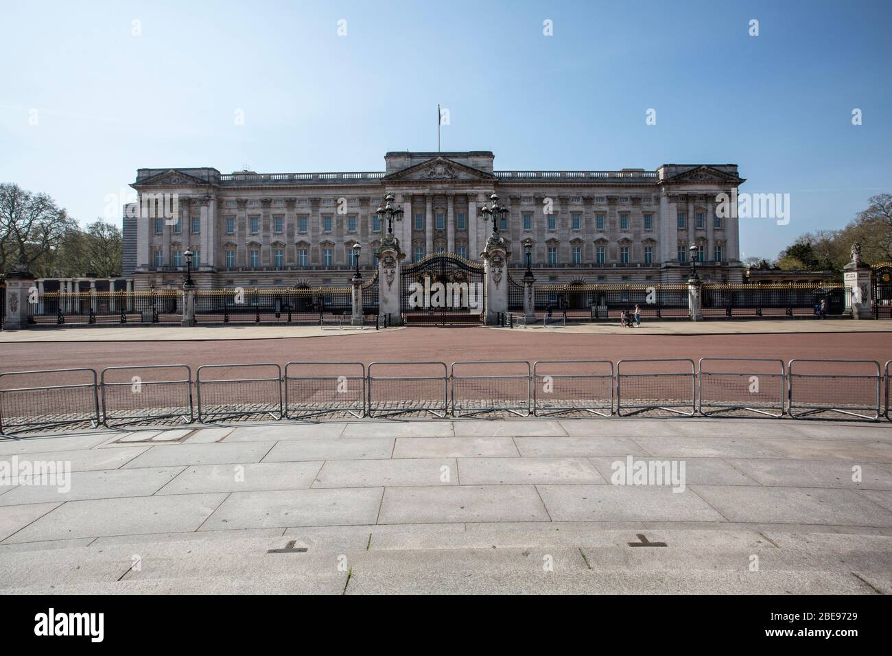 Empty pavements around Buckingham Palace during Easter Bank holiday as the coronavirus lockdown continues in central London and across United Kingdom. Stock Photo