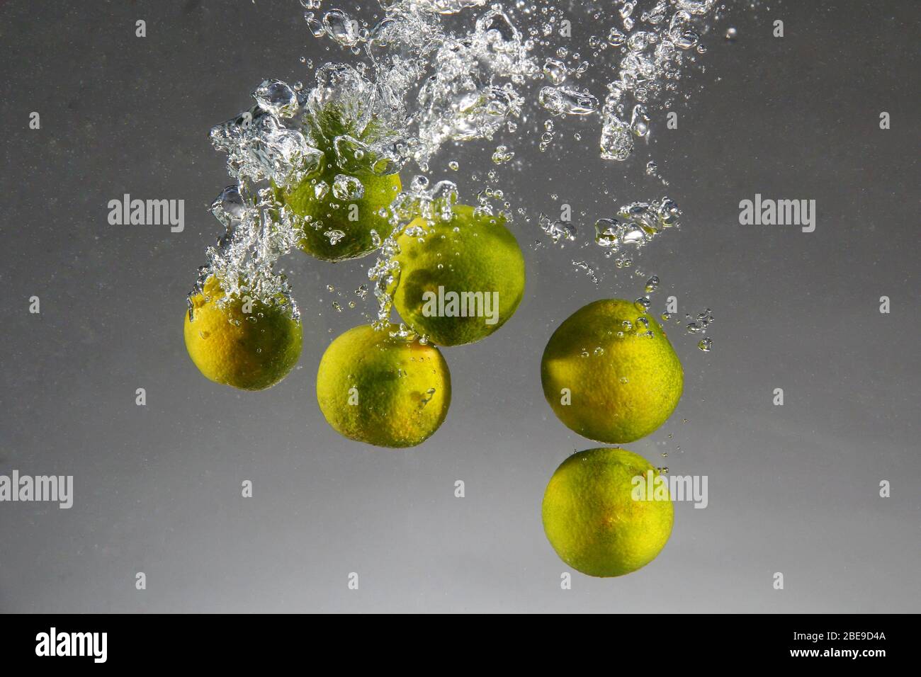 Photo of Calamondin or Philippine lime or calamansi dropped in water Stock Photo