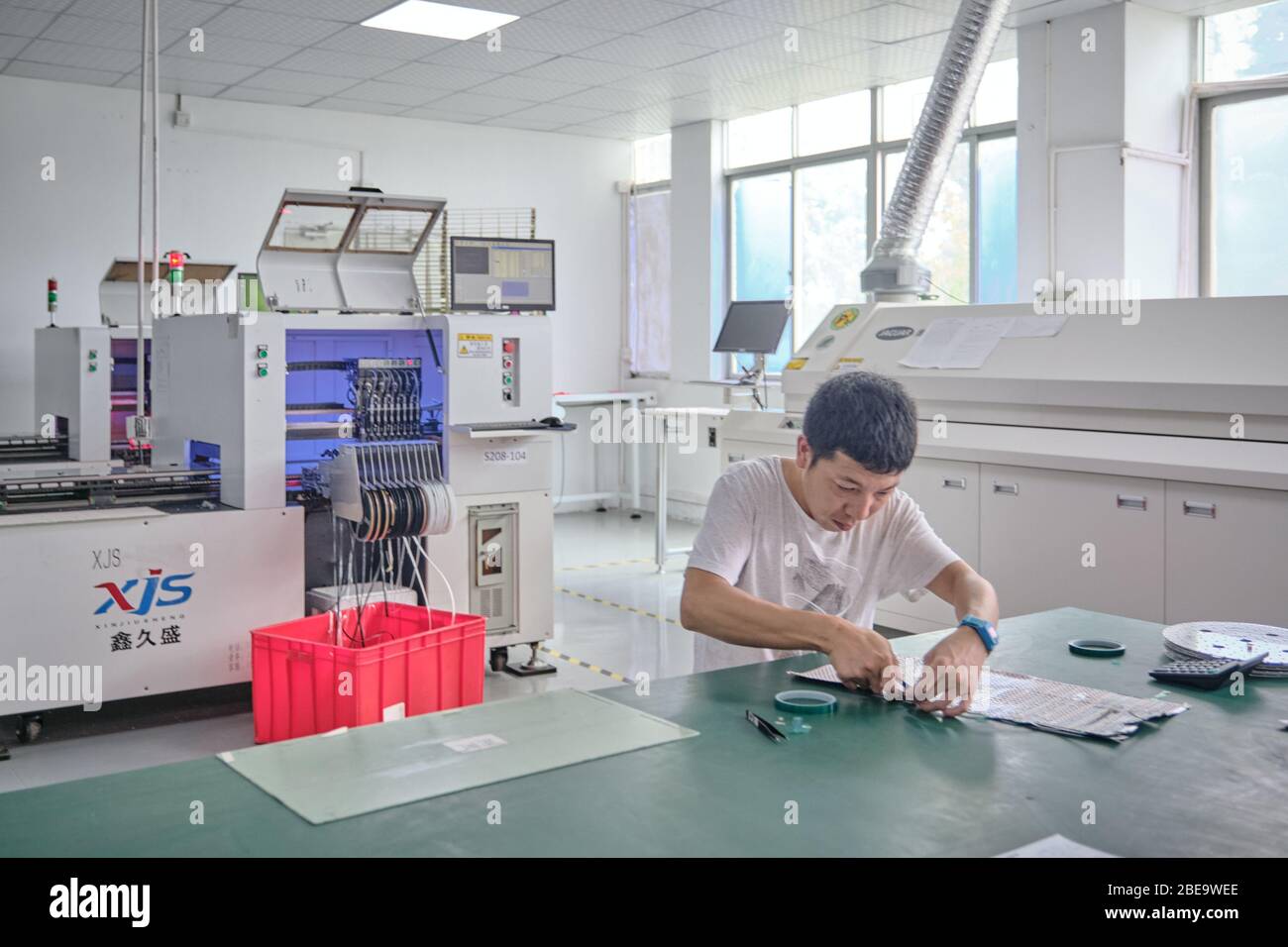 A worker manufacturing LED lights inside a LED factory in Shenzhen, China.An  analysis showed that China LED lighting market is going to cross the US$ 29  Billion mark by the year-end of