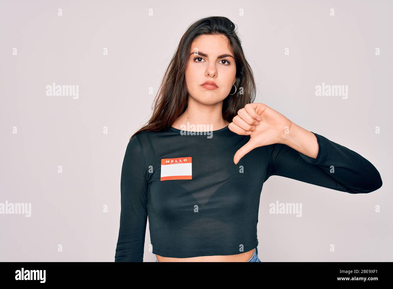 Young beautiful girl wearing Hello my name is sticker over isolated ...