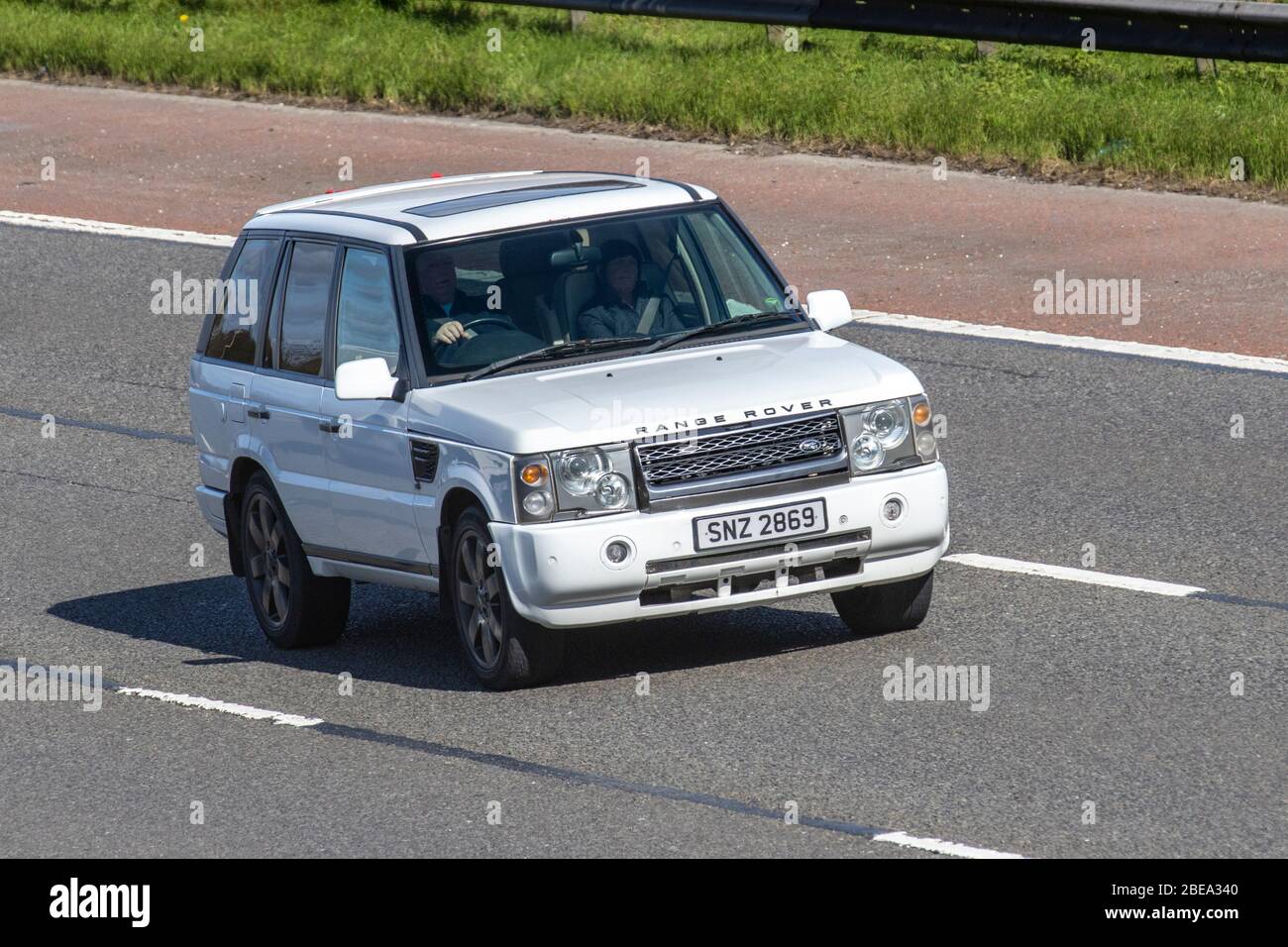 1997 white Land Rover Range Rover HSE Auto; Vehicular traffic moving vehicles, driving vehicle on UK roads, motors, motoring on the M6 motorway highway Stock Photo