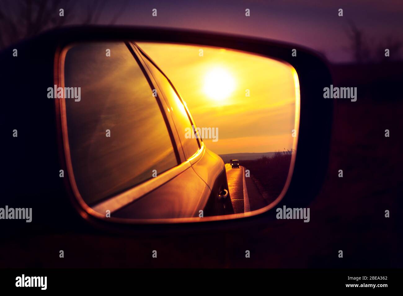 sunset reflection in the rearview car mirror Stock Photo Alamy